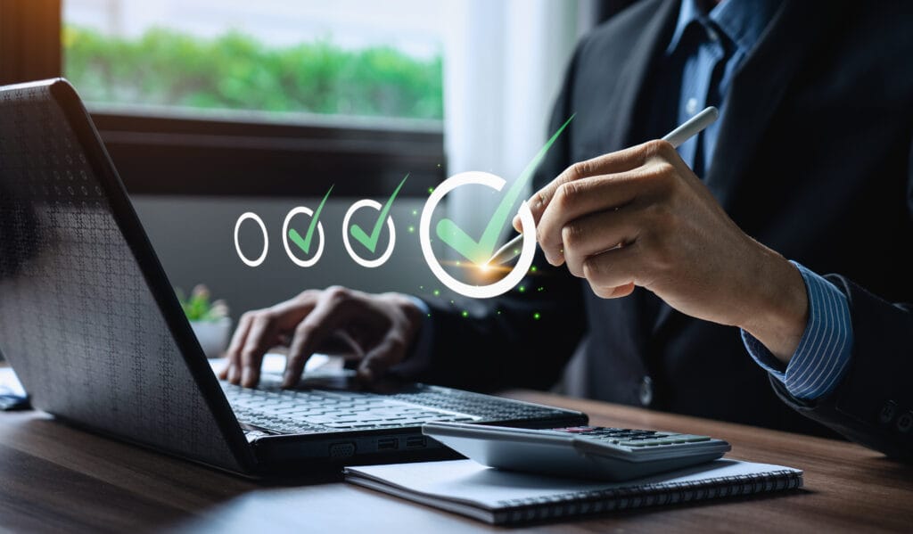 Business performance checklist, businessman using laptop doing online checklist survey, Check marks on checklist and Filling online form or answering questions. evaluation, online survey, online exam.